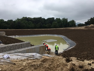 Construction d'un parc paysager servant à la gestion des eaux pluviales et des ouvrages hydrauliques nécessaires à son fonctionnement